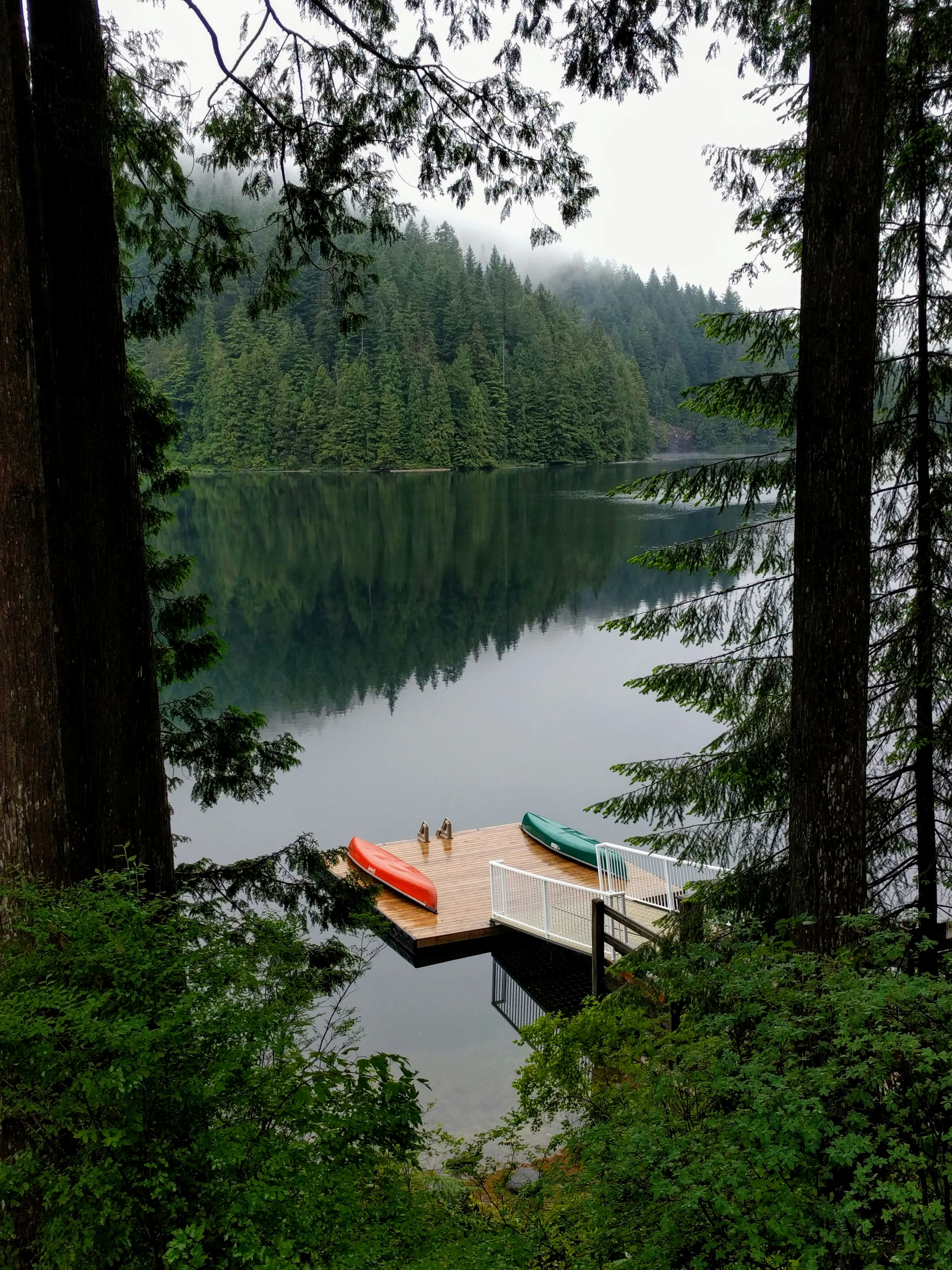 brown wooden boat on lake during daytime